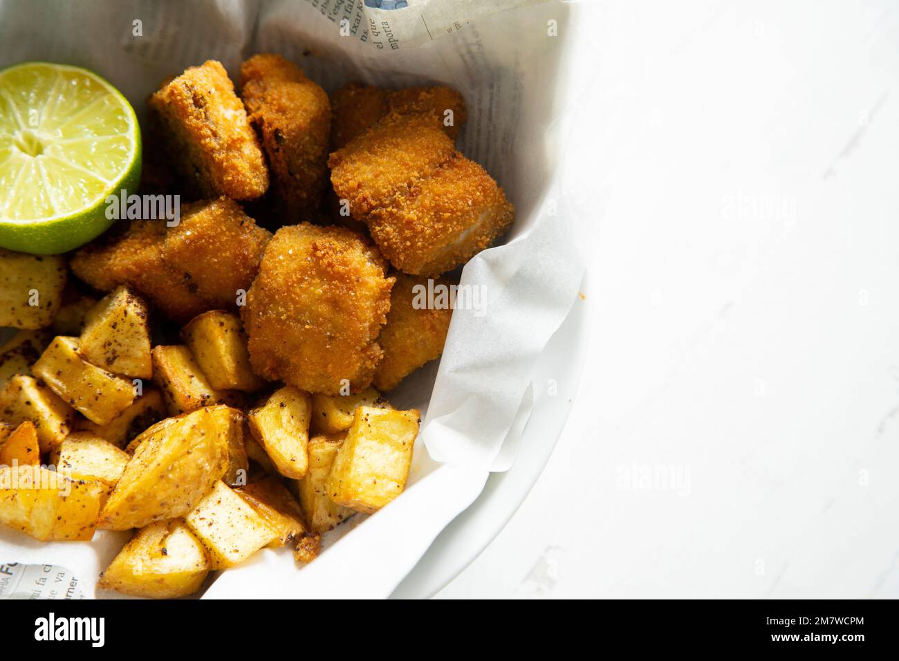Battered mackerel fish and chips with potatoes Stock Photo Alamy