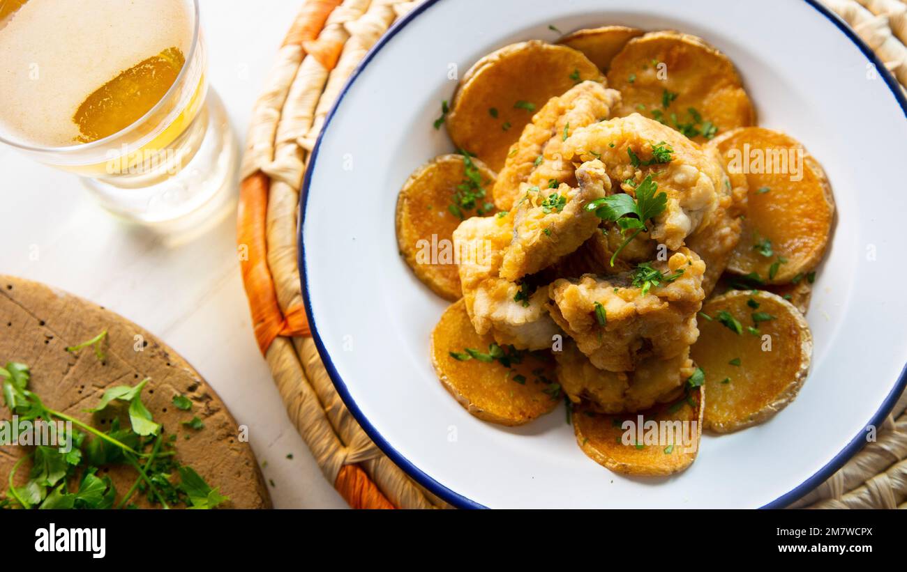Battered mackerel fish and chips with potatoes Stock Photo Alamy