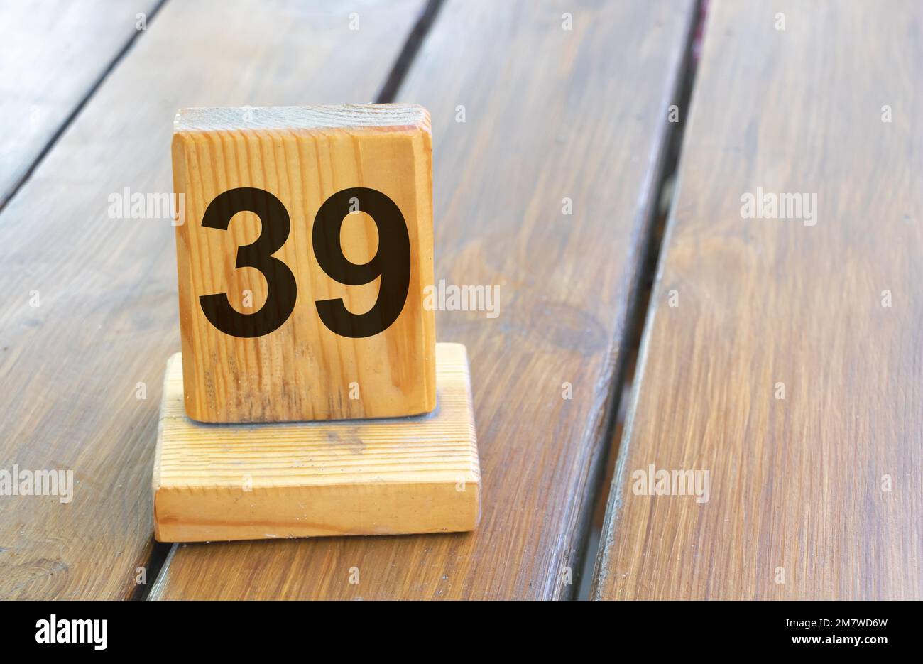 Wooden priority number 39 on a plank tab Stock Photo