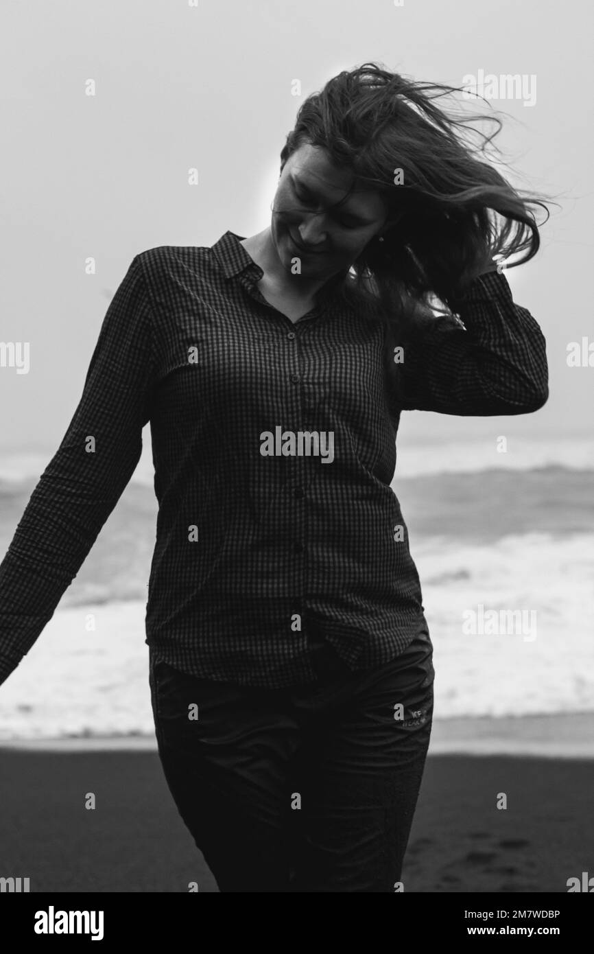 Close up funny woman on Iceland beach monochrome portrait picture Stock Photo