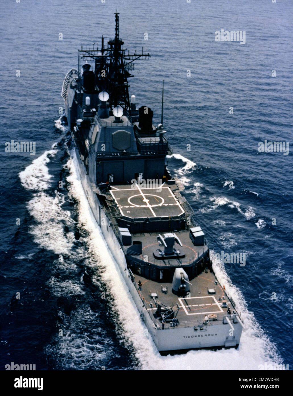 An aerial port quarter view of the Aegis guided missile cruiser USS ...