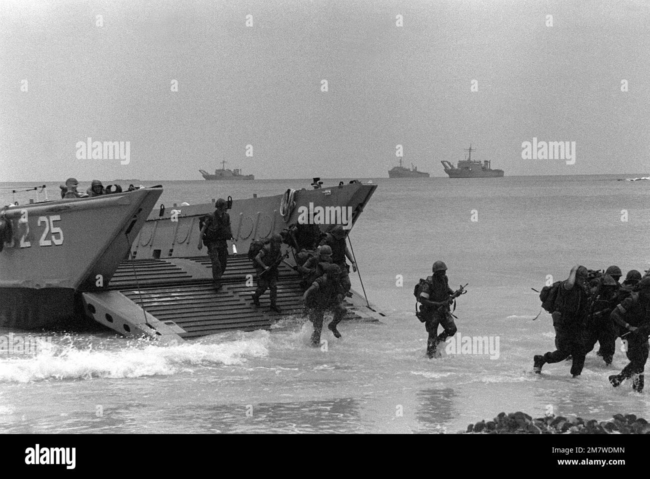 Marines from the Fourth Marine Amphibious Brigade disembark from an LCM
