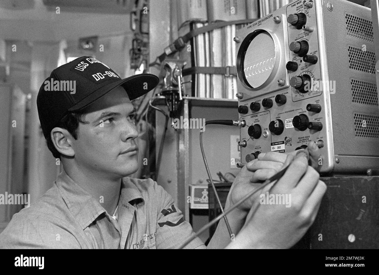 Electronics Technician 2nd Class Cameron Christie calibrates an