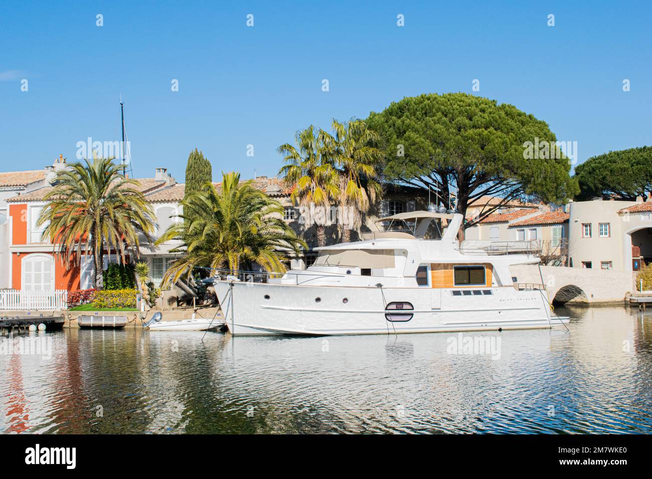 Port grimaud hotels boats and river day time Stock Photo Alamy