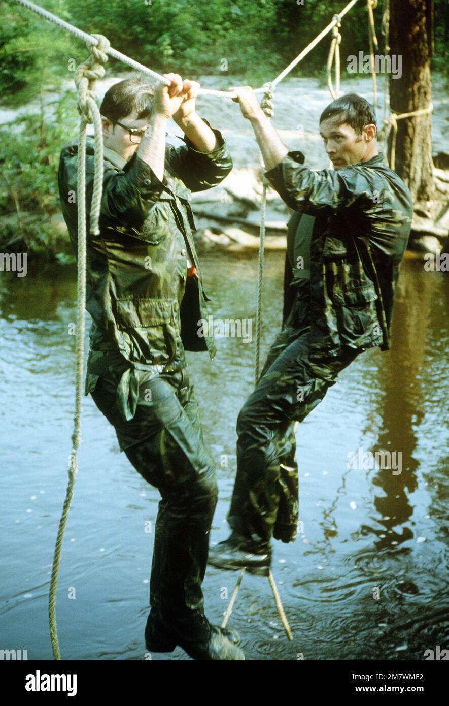 Security policemen cross a rope bridge during the combat tactics ...