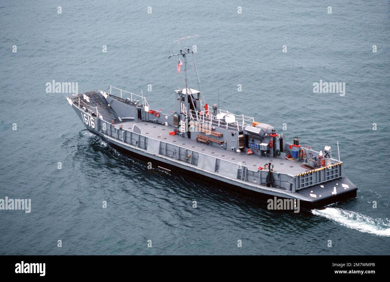 An aerial port quarter view of a utility landing craft (LCU-1616) attached to Assault Craft Unit One (ACU-1) during a practice landing at the Silver Strand area of North Island. Base: San Diego State: California (CA) Country: United States Of America (USA) Stock Photo