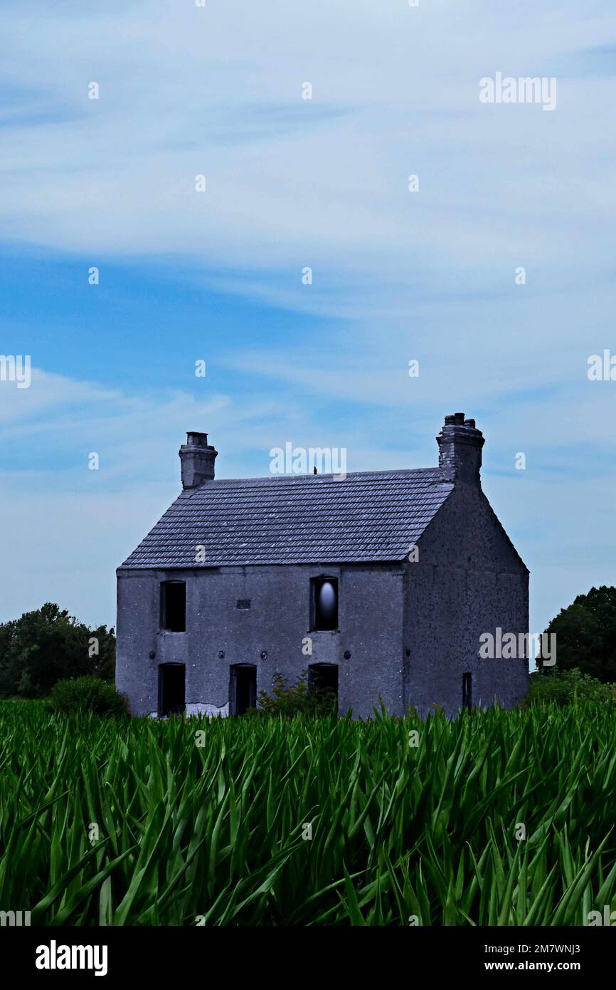Derelict abandoned empty house, alone in the fields, spooky mysterious