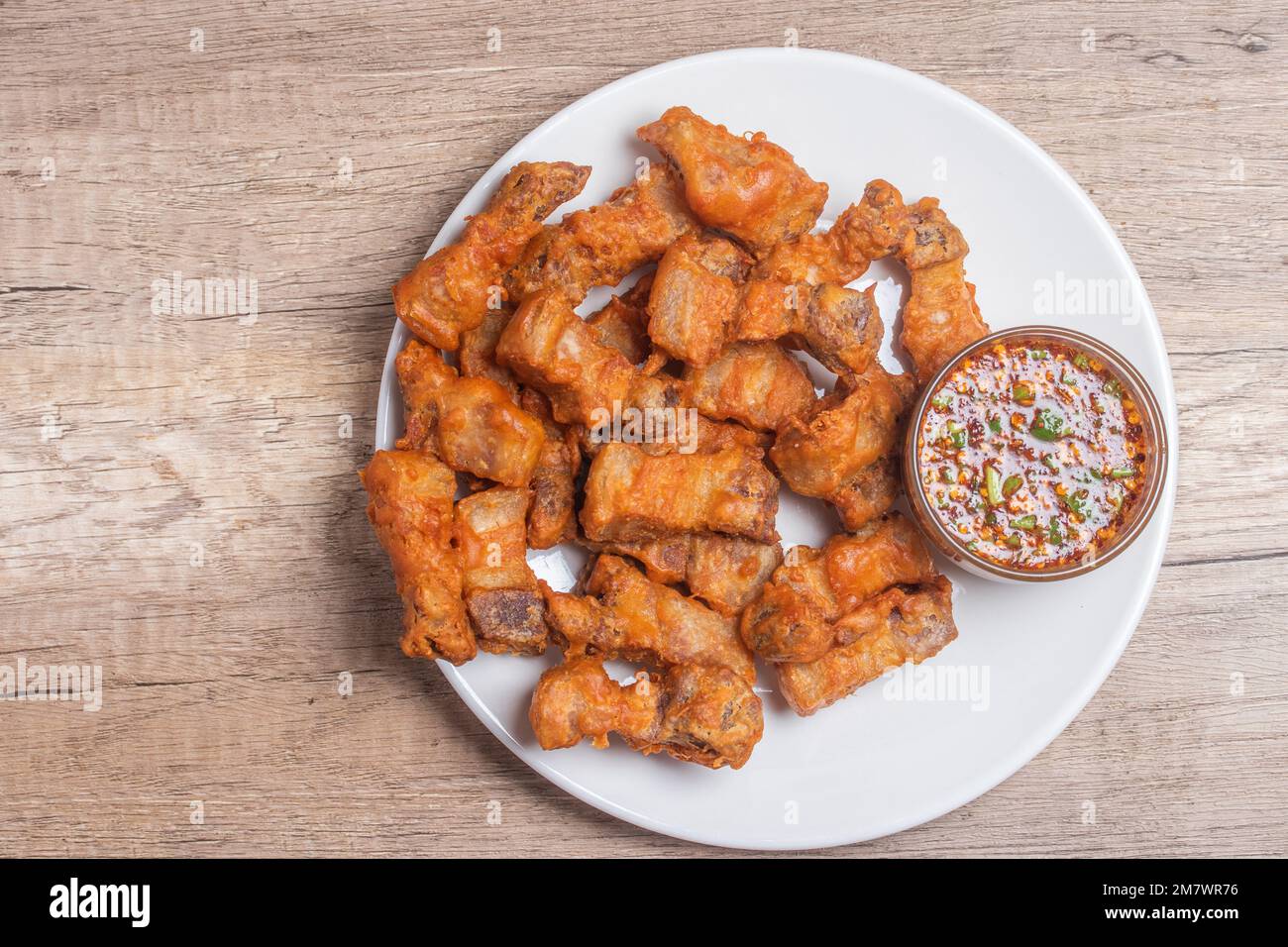 Deep fried pork belly with fish sauce and spicy dipping sauce Stock