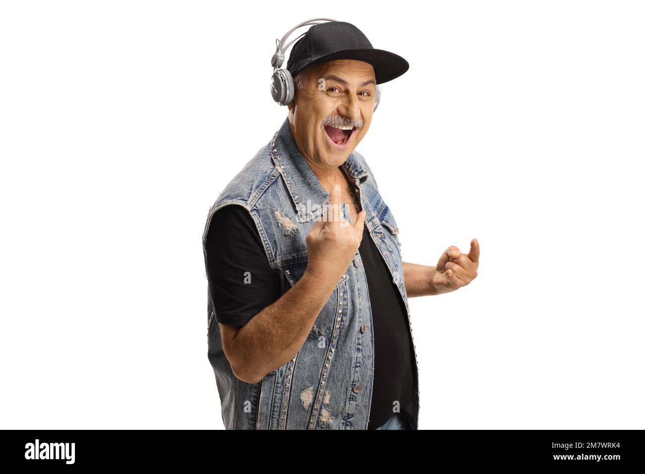 Cool mature man with headphones gesturing rock and roll sign isolated on white background Stock Photo