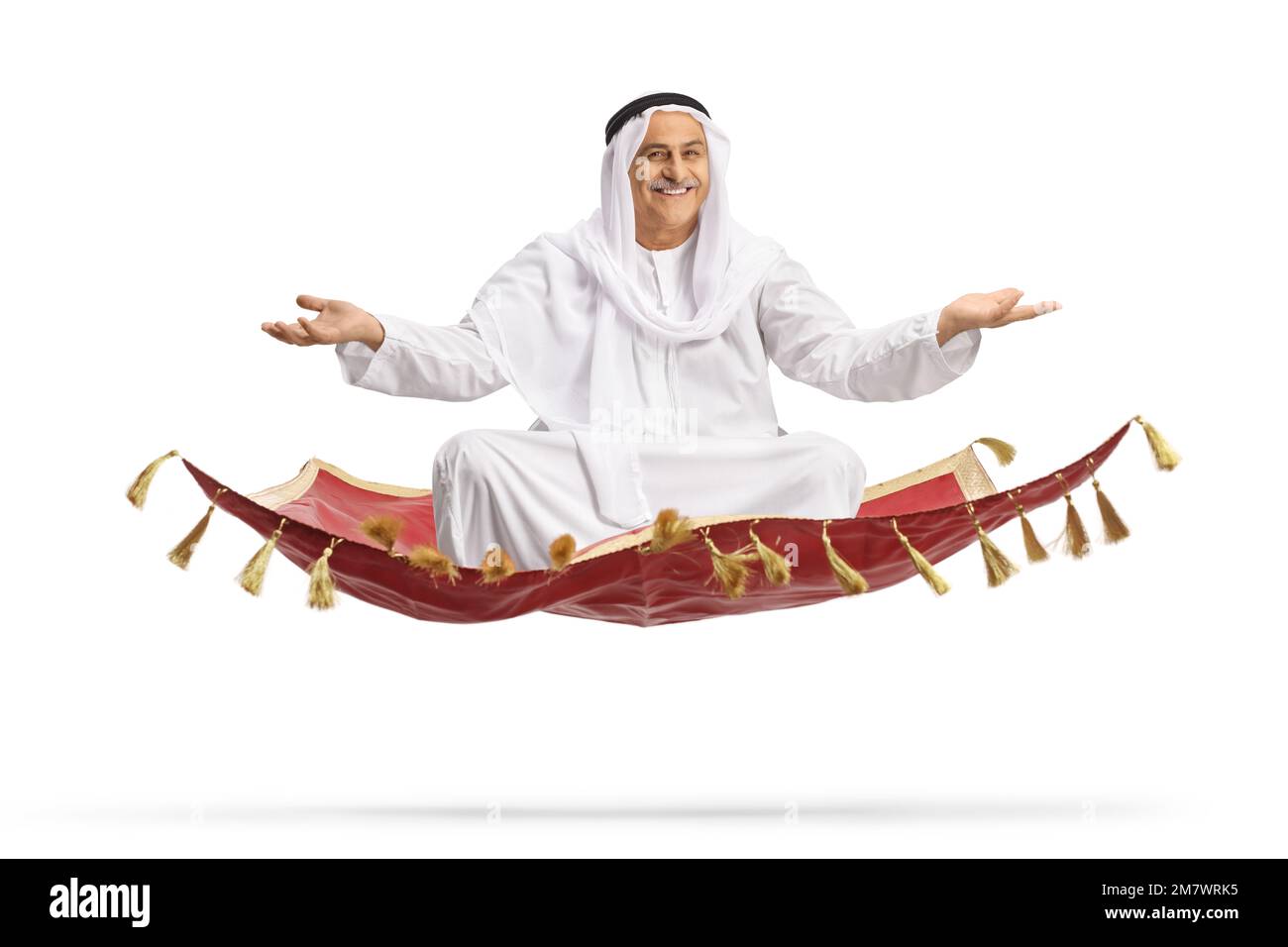 Arab man sitting on a flying carpet isolated on white background Stock Photo