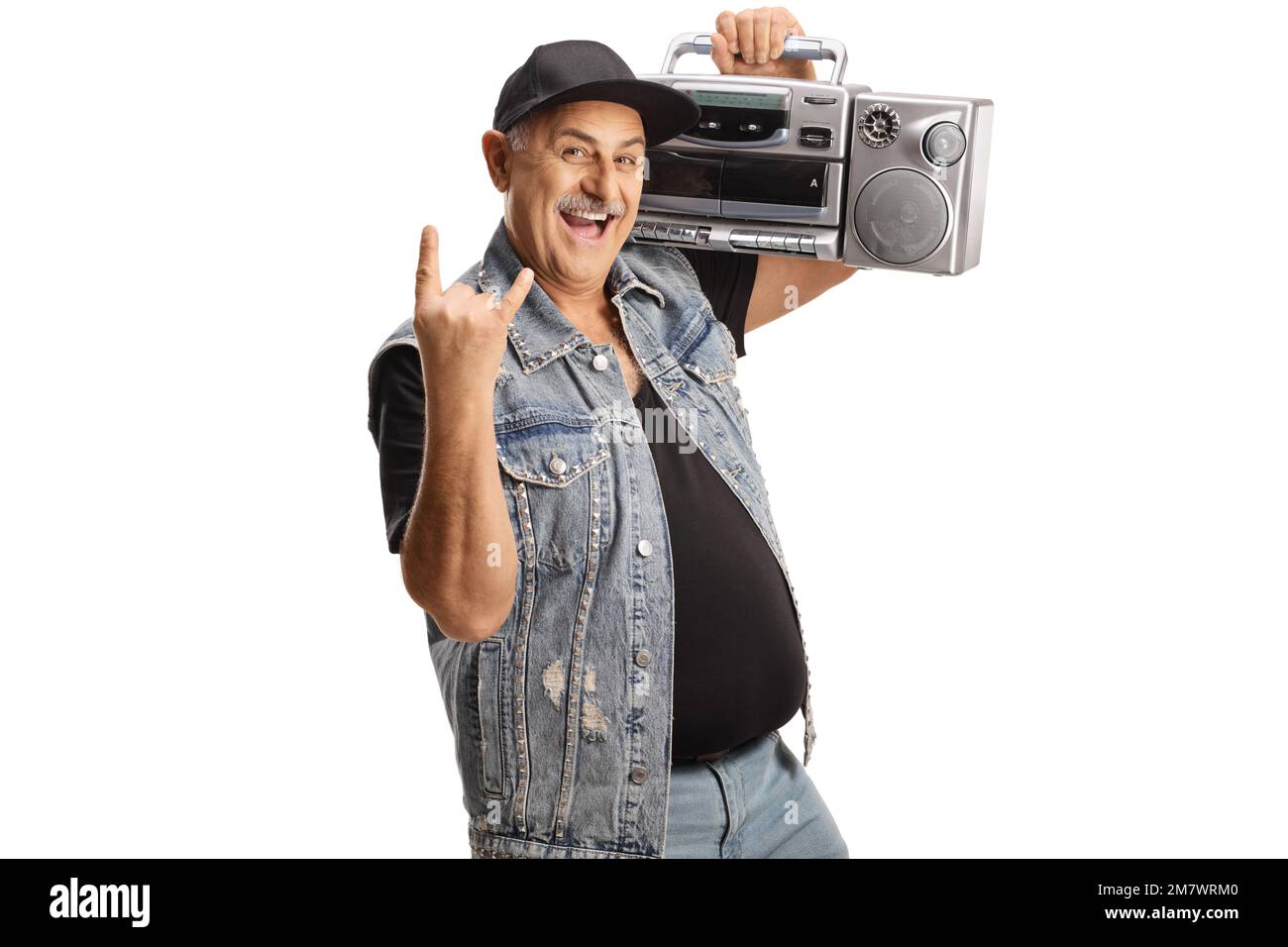 Cheerful mature man carrying a boombox radio and gesturing rock and roll sign isolated on white background Stock Photo