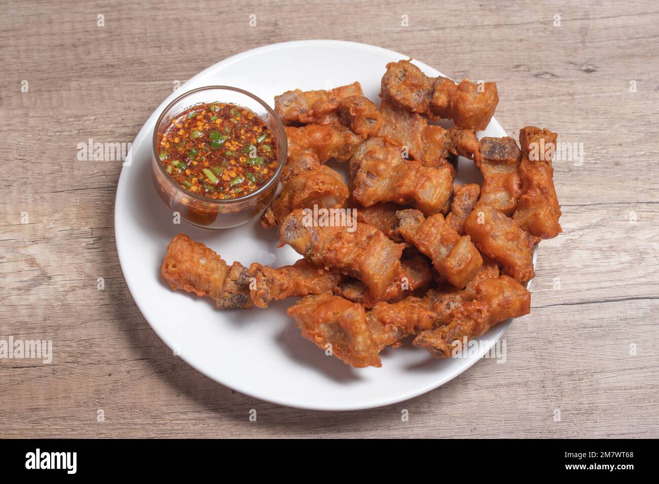 Deep fried pork belly with fish sauce and spicy dipping sauce Stock