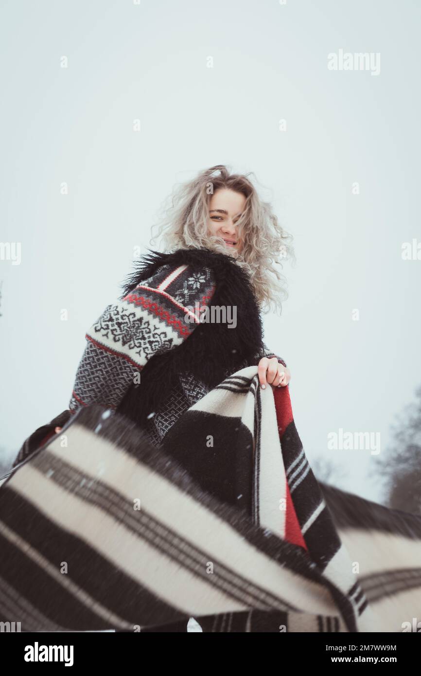 smiling-woman-in-traditional-clothes-in-winter-portrait-picture-stock