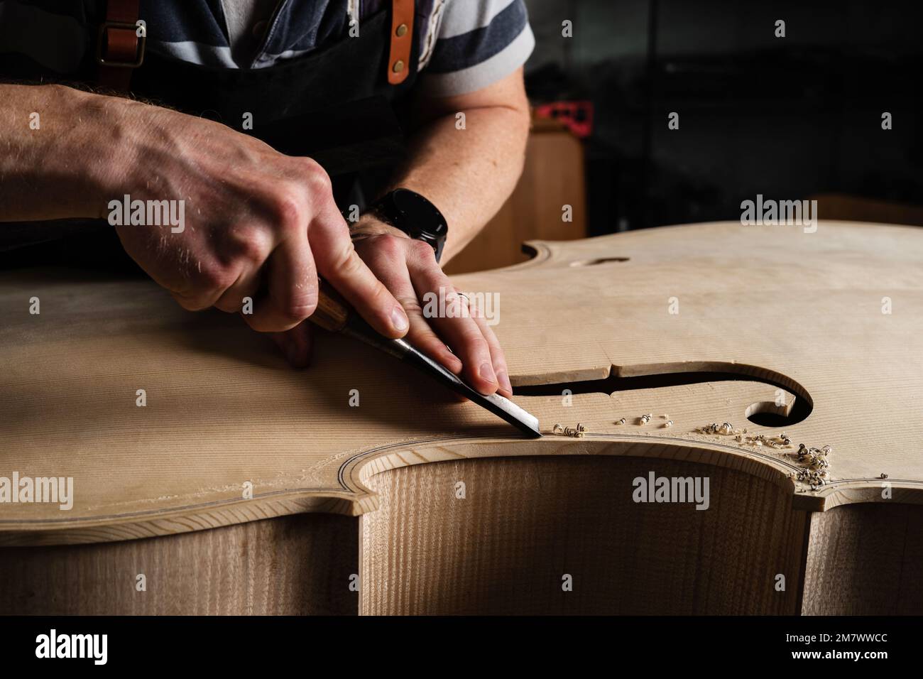 Troyes (north-eastern France): Laurent Demeyere, stringed instrument maker specialized in double bass. Here, making a double bass. Gestures and woodwo Stock Photo