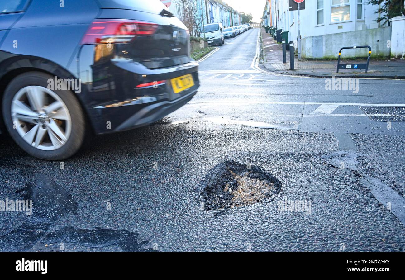 Pothole in a Brighton road , Sussex , England UK January 2023 . Thousands of potholes have appeared in roads around the UK after the recent bad winter weather  Credit Simon Dack Stock Photo