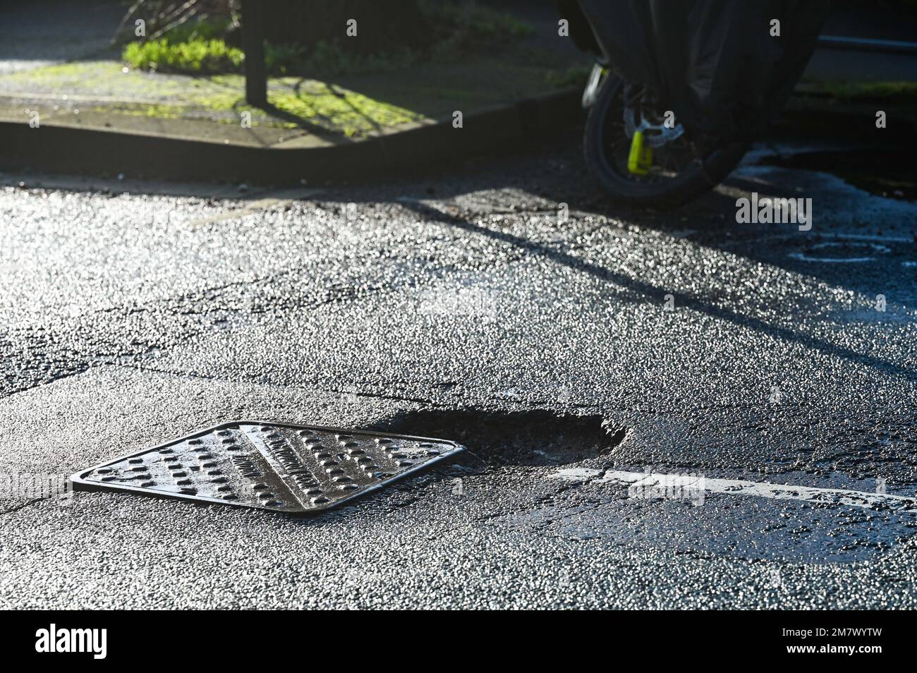 Pothole in a Brighton road , Sussex , England UK January 2023 . Thousands of potholes have appeared in roads around the UK after the recent bad winter weather  Credit Simon Dack Stock Photo