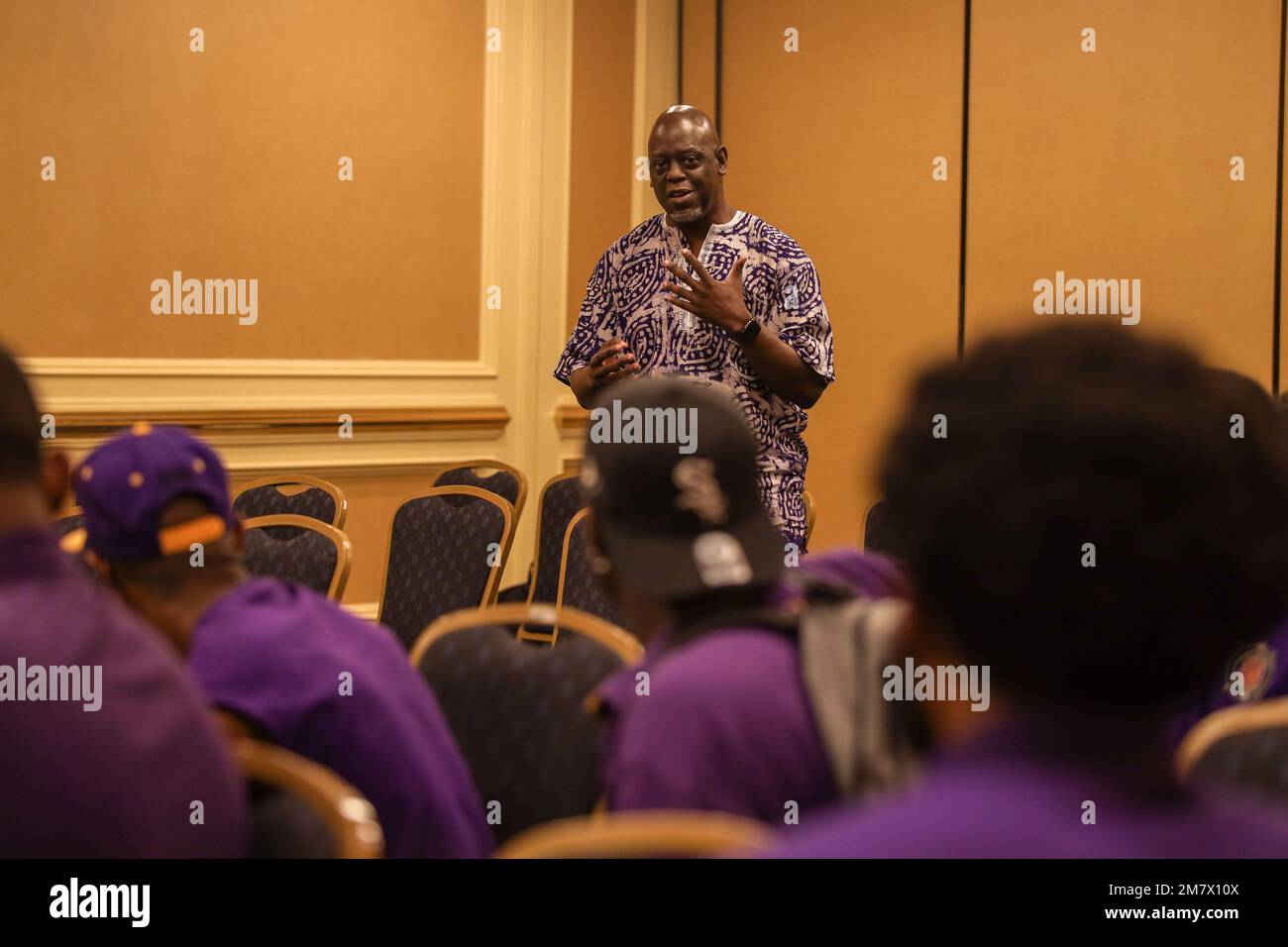 A Marine veteran answers a question during Omega Psi Phi Fraternity Inc