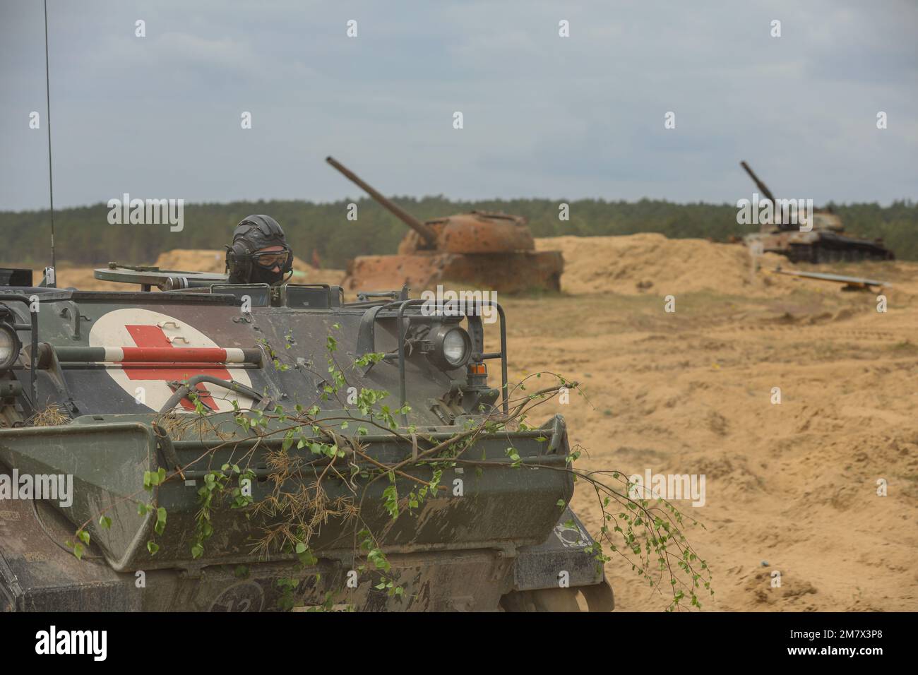 A Polish M113 Armored Personnel Carrier vehicle advances onto the battlefield as part of a field training exercise during Defender Europe at Mielno Range, Poland, May 14, 2022. Defender Europe 22 is a series of U.S. Army Europe and Africa multinational training exercises in Eastern Europe. The exercise demonstrates U.S. Army Europe and Africa’s ability to conduct large-scale ground combat operations across multiple theaters supporting NATO. Stock Photo