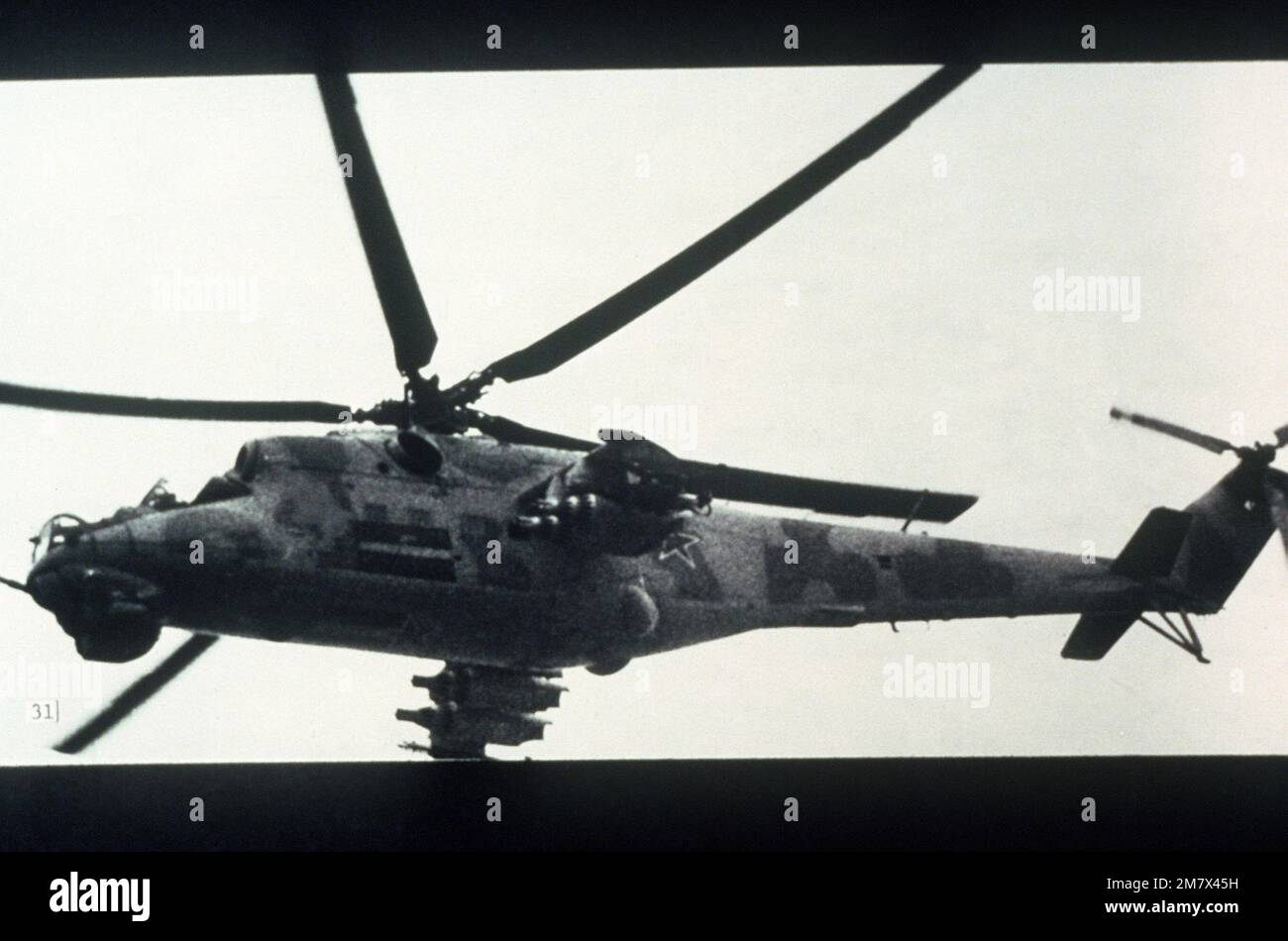 Mi-24/Hind-D helicopter with turreted gattling gun. (PHOTO courtesy of Soviet Military Power Magazine, PHOTO #31, Page 35 (top right)). Country: Unknown Stock Photo