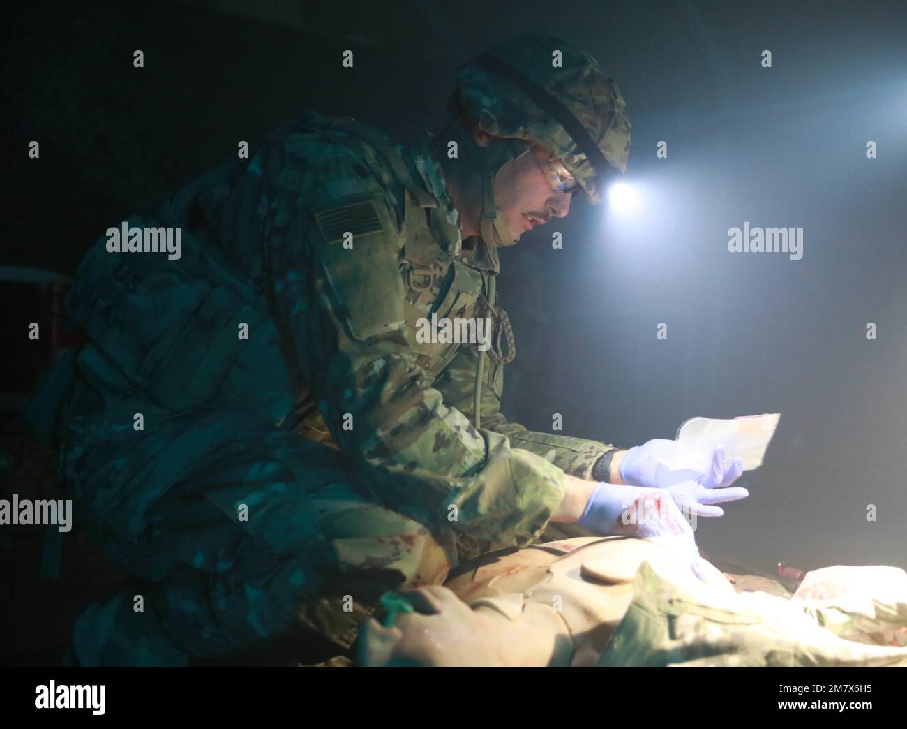 Sgt. Chandler Dye, combat medic for the 35th Infantry Division conducts