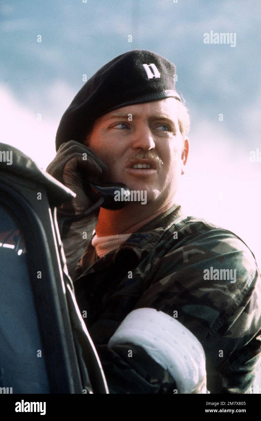 Forward air controller CPT Patton, using a radio, confirms the bomb