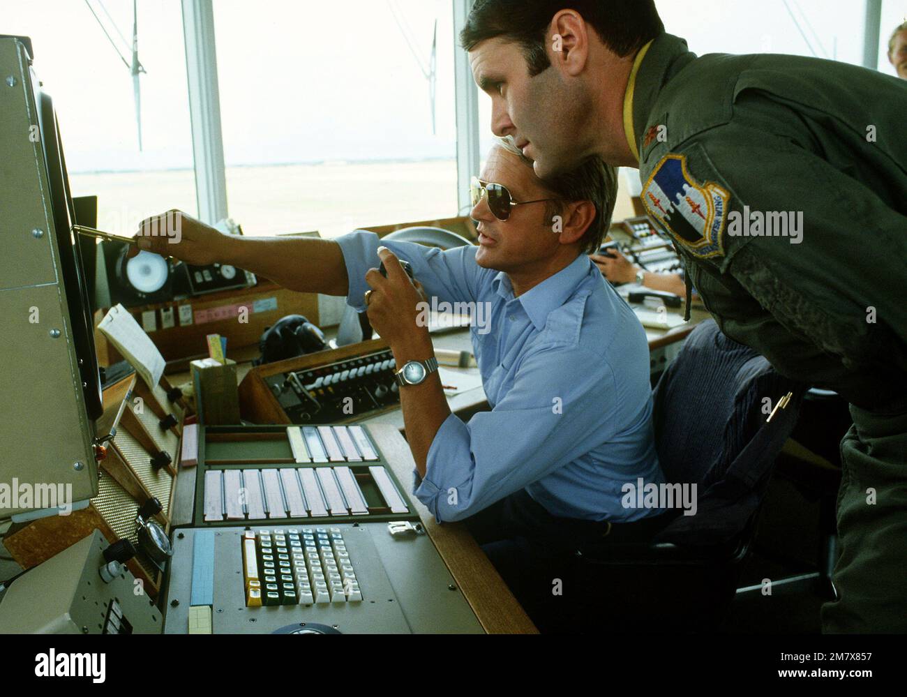MAJ Don McCabe, right, is briefed by a Danish air controller in the