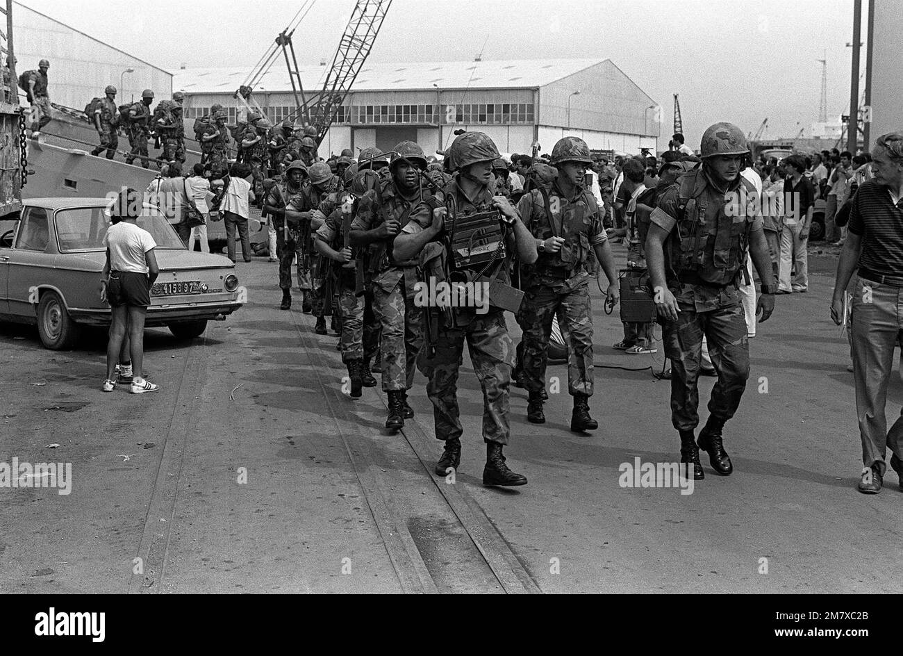 Marines from the 32nd Marine Amphibious Unit leave the tank landing ...