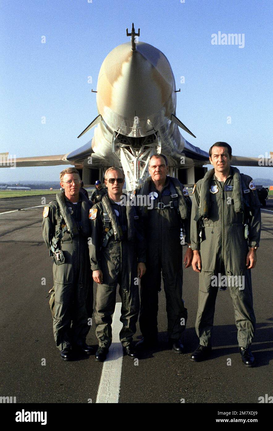 the-flight-crew-of-a-b-1-bomber-pose-in-front-of-the-aircraft-during
