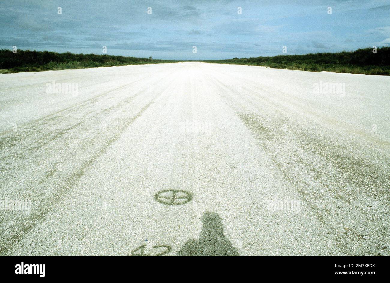 A view of the North Field prime runway from the 4,200 feet marker pointing east, during Exercise Kennel Bear '4-82. This airfield was primarily used during World War II. Subject Operation/Series: KENNEL BEAR '4-82 Base: Tinian Island Country: Northern Mariana Islands (MNP) Stock Photo