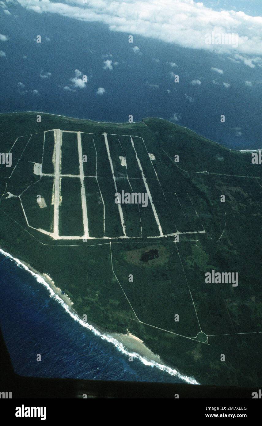 An aerial view of the North Field prime runway, during Exercise Kennel Bear '4-82. This airfield was primarily used during World War II. Subject Operation/Series: KENNEL BEAR '4-82 Base: Tinian Island Country: Northern Mariana Islands (MNP) Stock Photo