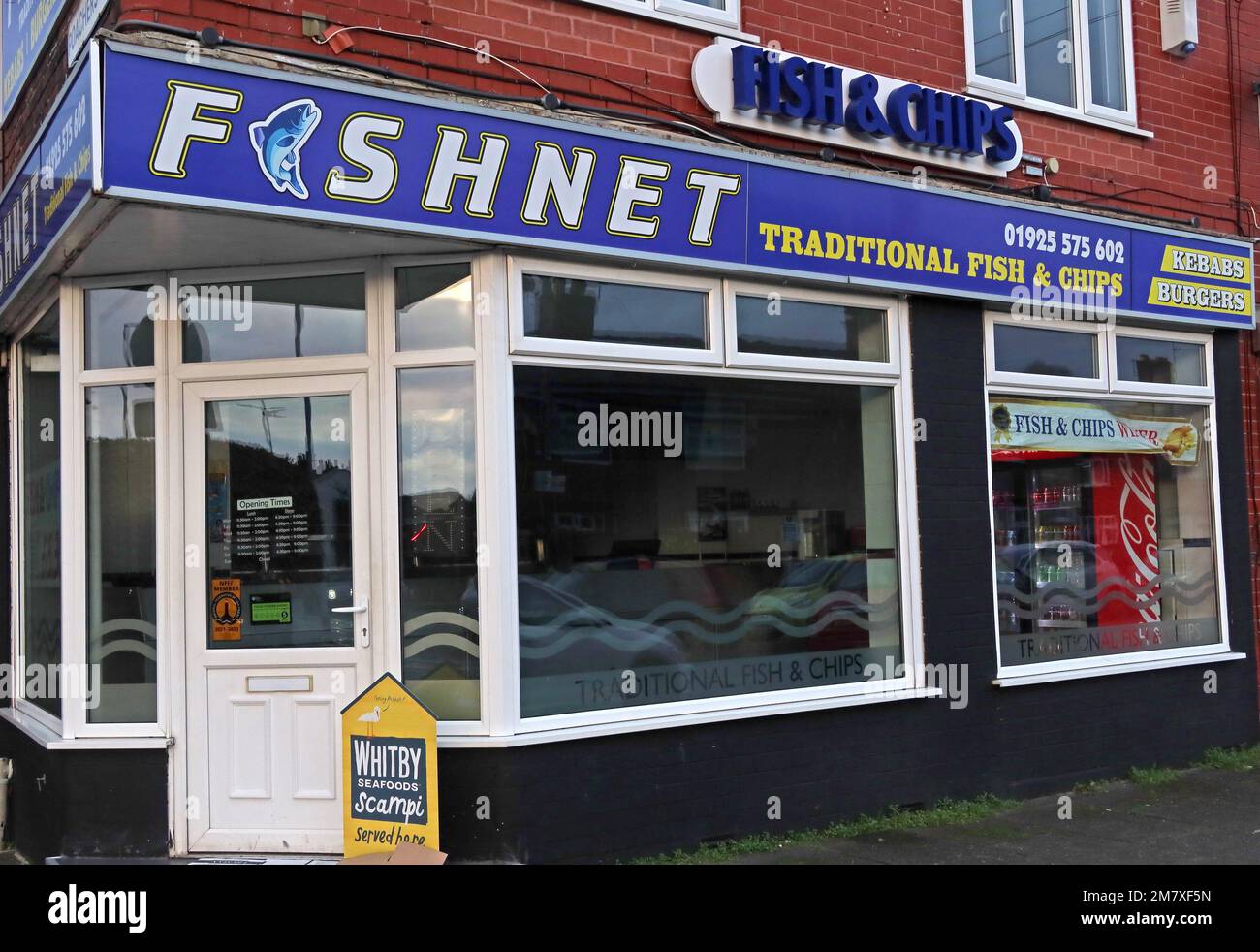 Fishnet, a traditional British Fish & Chip shop, at 124 Thelwall Lane, Latchford, Warrington, Cheshire, England, UK, WA41LU Stock Photo