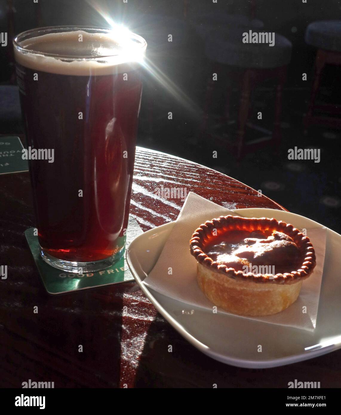 A pint and a pie, the perfect liquid lunch, in a British bar Stock Photo