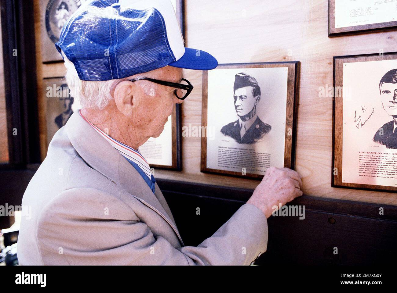 Maynard Harrison Smith, a World War II air mission Medal of Honor recipient, examines the plaque commemorating his award. Smith is attending a reunion of US Air Force Medal of Honor recipients. Base: Griffiss Air Force Base State: New York (NY) Country: United States Of America (USA) Stock Photo