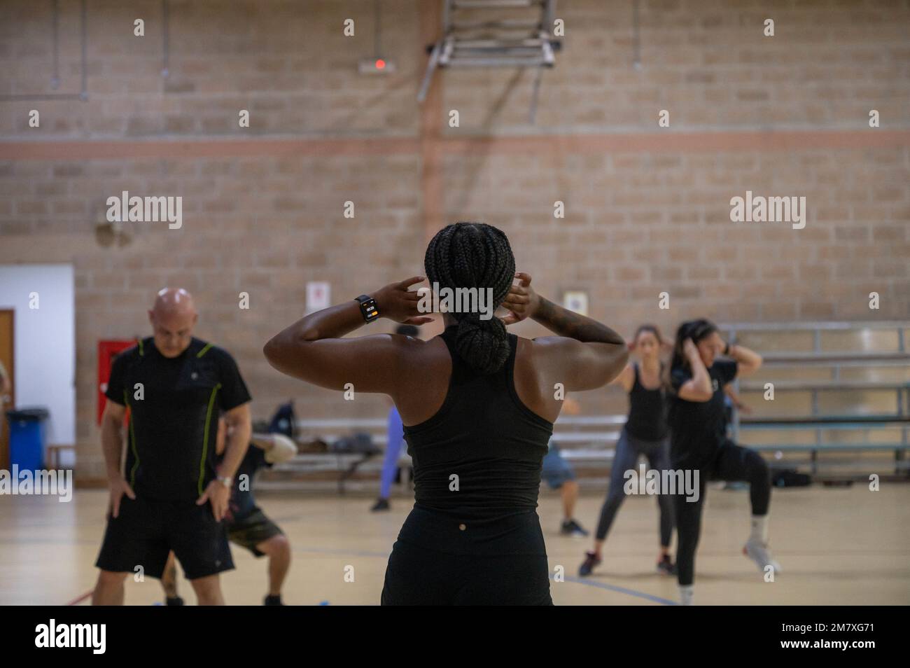 https://c8.alamy.com/comp/2M7XG71/us-air-force-staff-sgt-armana-reid-with-the-386th-expeditionary-logistics-readiness-squadron-teaches-a-high-intensity-interval-training-class-at-the-flex-fitness-center-at-ali-al-salem-air-base-kuwait-may-14-2022-various-classes-are-held-weekly-to-ensure-us-service-members-and-coalition-partners-stay-fit-to-perform-the-mission-2M7XG71.jpg