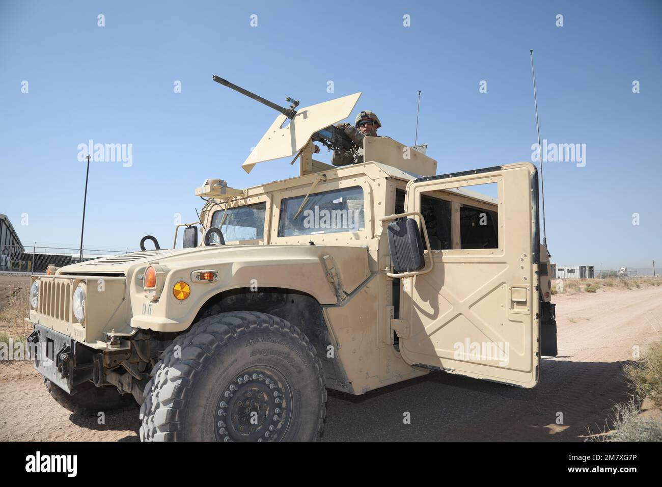 An 11th Air Defense Artillery Brigade Solider pulls guard from a Humvee gunner turret during Roving Sands 2022. Roving Sands is an exercise is an opportunity to influence the operational capability and training methods used by Air Defense Artillery Brigades to test their systems in large scale combat simulations. Stock Photo