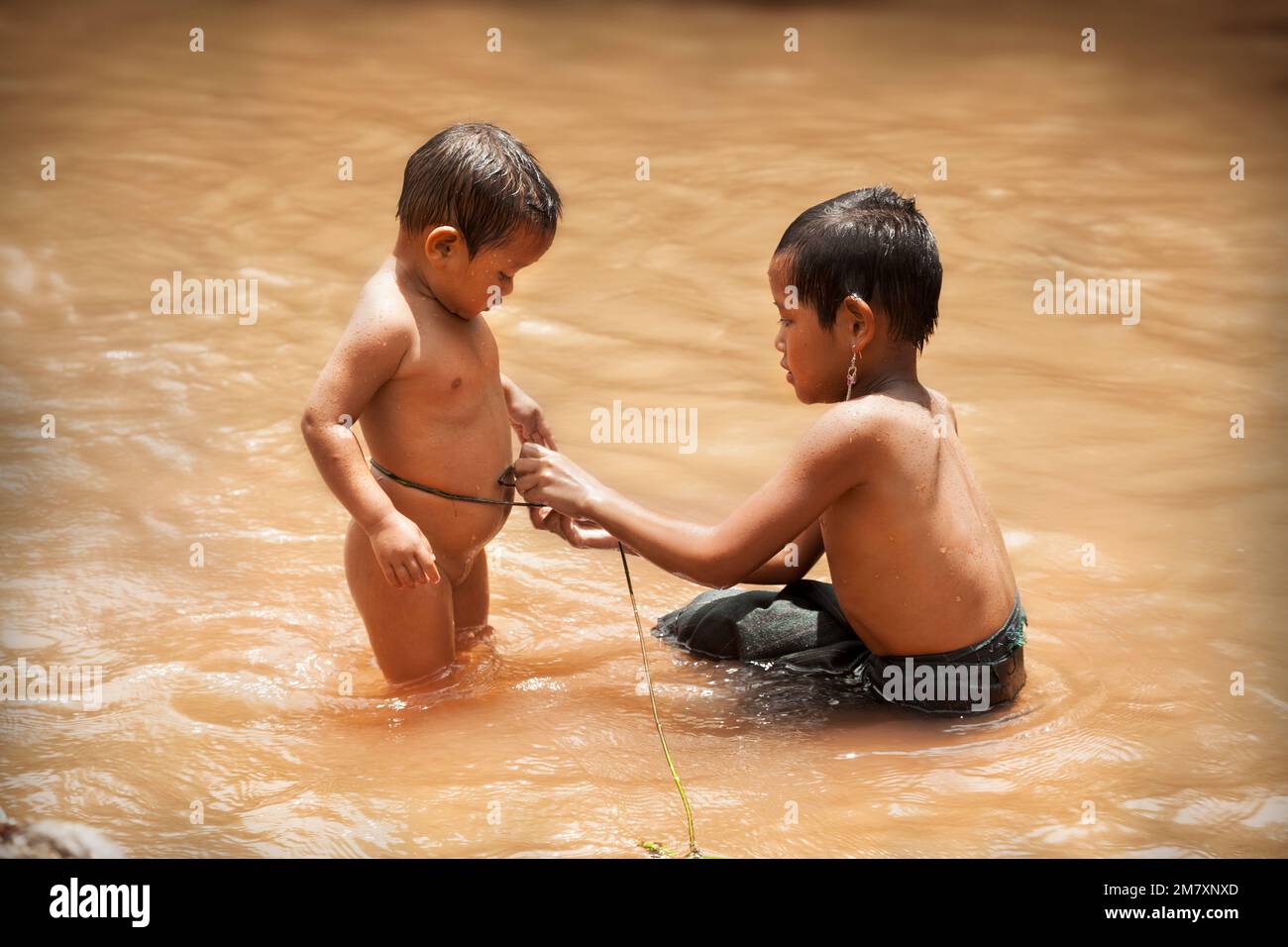 bathing children laos Luang Nam Tha,Laos-July 7, 2009: Children playing in the river in a Khamu  town in the north of Laos near to Luand Nam Tha Stock Photo - Alamy