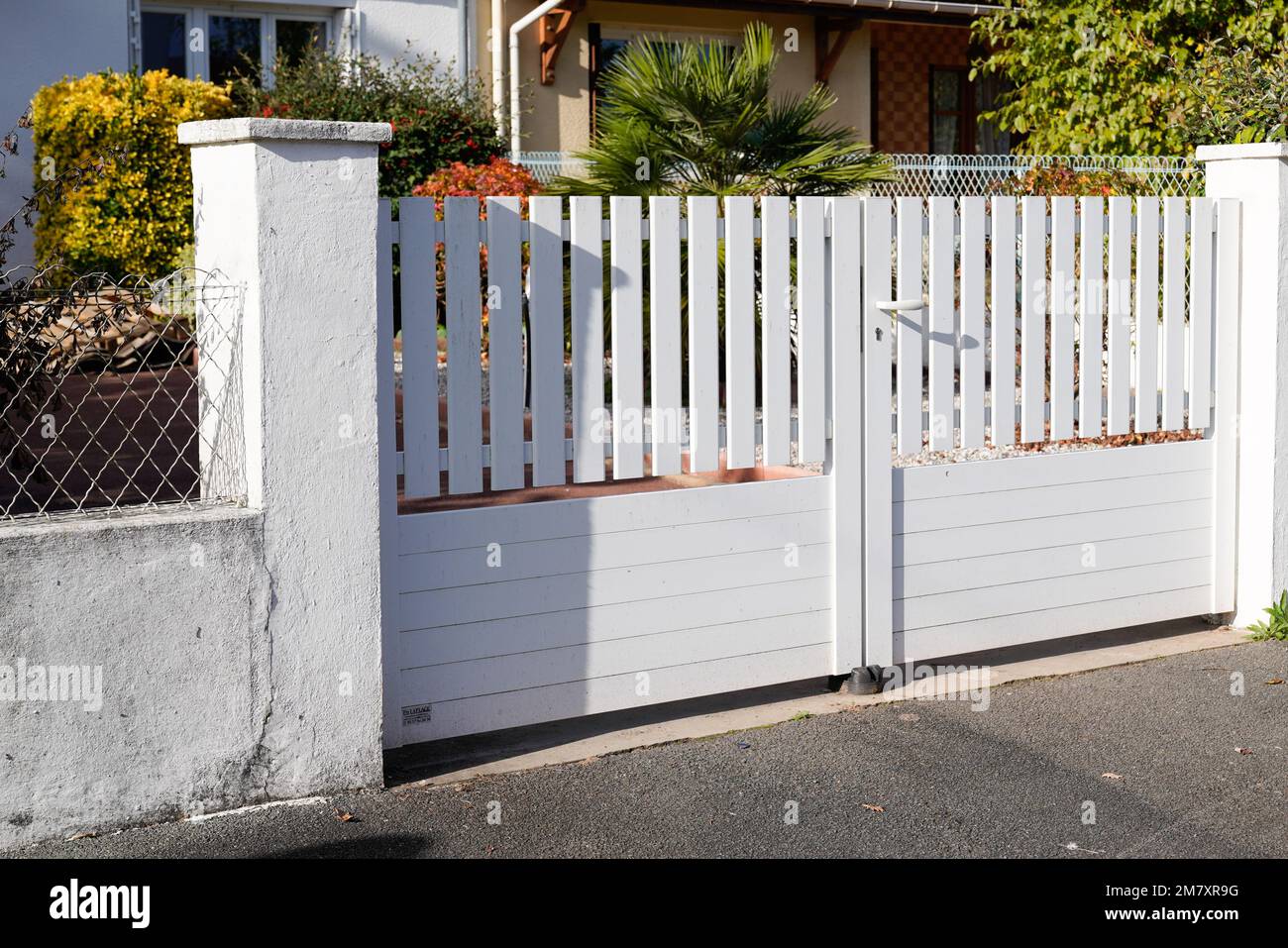 white classic street home door gate slats portal of suburb house Stock Photo