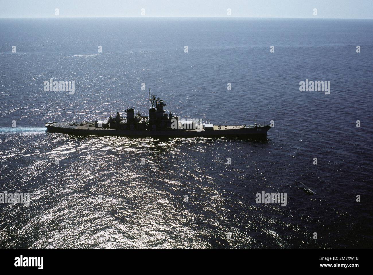Aerial starboard beam view of the battleship NEW JERSEY (BB62) on sea