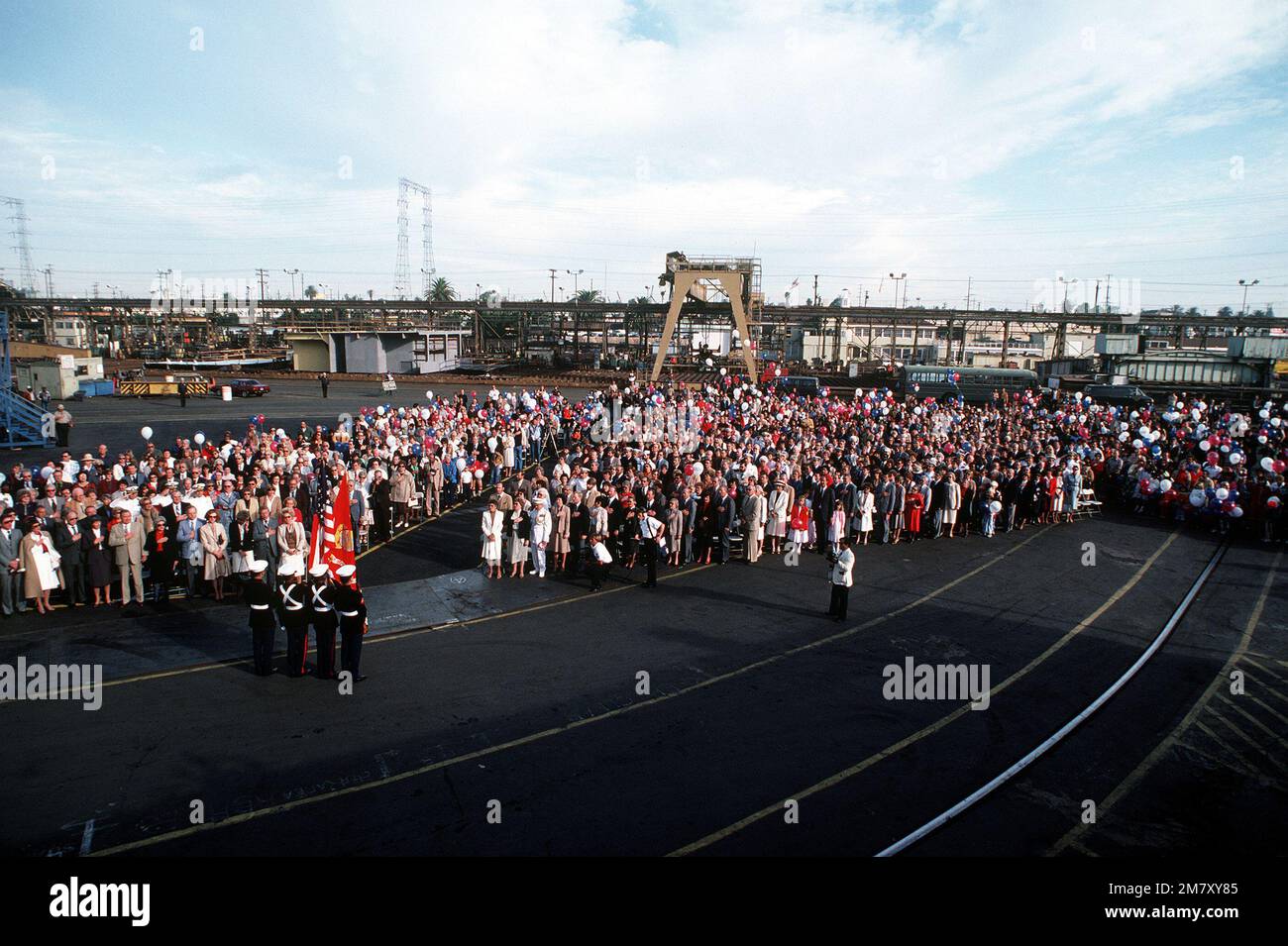 Guests stand for the national anthem during the launching ceremony for the cable repair ship USNS ZEUS (T-ARC-7). The ship was built by the National Steel and Shipbuilding Company. Base: San Diego State: California (CA) Country: United States Of America (USA) Stock Photo
