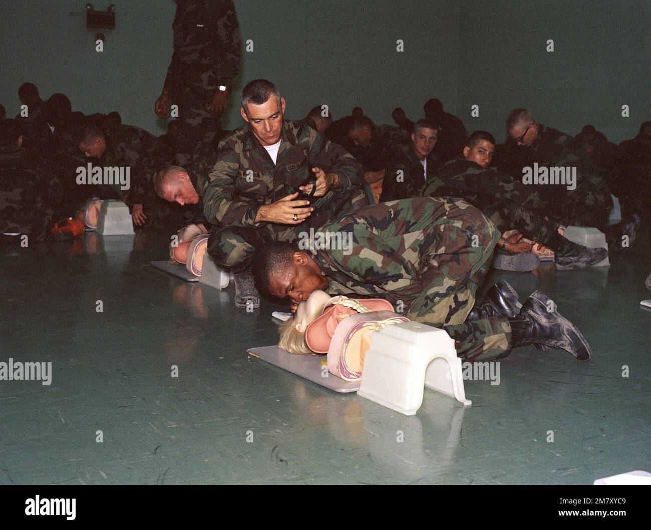 Infantrymen receive instruction in cardiopulmonary resuscitation (CPR) during a firstaid