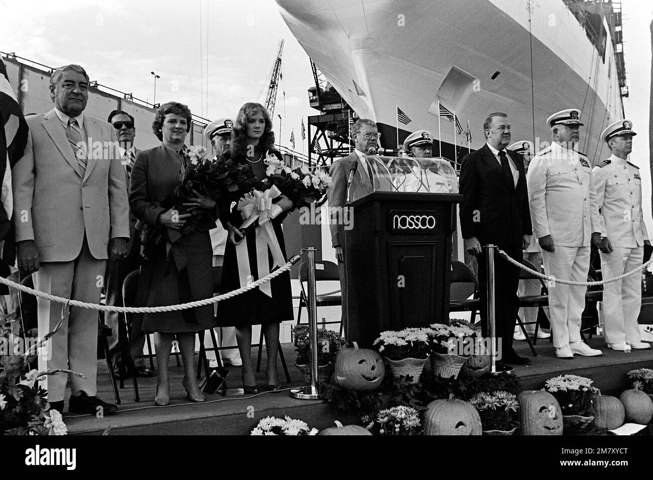 Edwin Meese III, counselor to the president, (right of the podium) stands on the speakers platform with other dignitaries, during the launching ceremony for the cable repair ship USNS ZEUS (T-ARC-7). The ship was built by the National Steel and Shipbuilding Company. Base: San Diego State: California (CA) Country: United States Of America (USA) Stock Photo