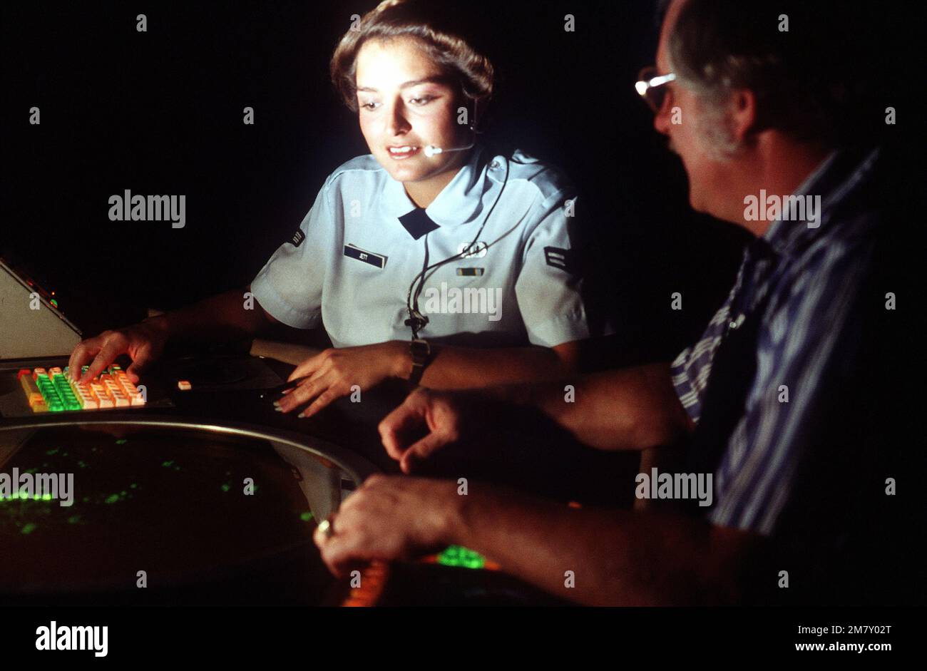 AIRMAN 1ST Class Mary Jett, an air traffic controller, is trained on a
