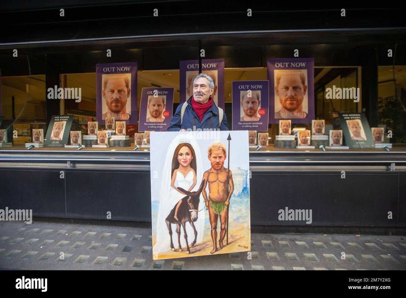 London, England, UK. 11th Jan, 2023. British artist KAYA MAR poses with his latest painting depicting Prince Harry as Don Quixote outside Waterstones bookstore where the royal's memoir Spare is on sale after being launched yesterday. (Credit Image: © Tayfun Salci/ZUMA Press Wire) EDITORIAL USAGE ONLY! Not for Commercial USAGE! Stock Photo