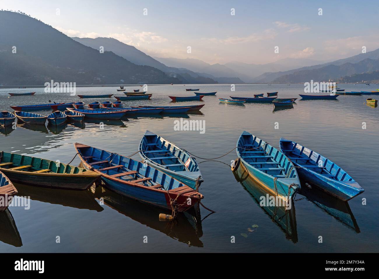 Pokhara, Nepal ; DEcember 4th, 2022; Multi coloured Boats moored  in Phewa Lake Stock Photo