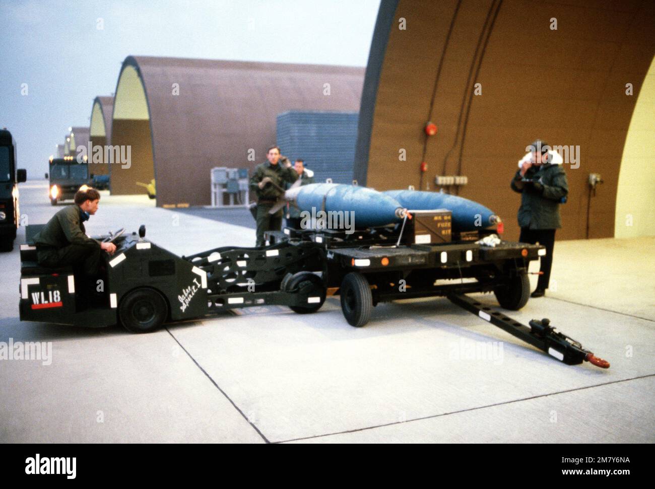 Team members of the 36th Aircraft Maintenance Unit begin Sabre Spirit I munitions loading competition by loading an F-4E Phantom II aircraft with a Mark 84 2,000-pound bomb. Base: Osan Air Base Country: Republic Of Korea (KOR) Stock Photo