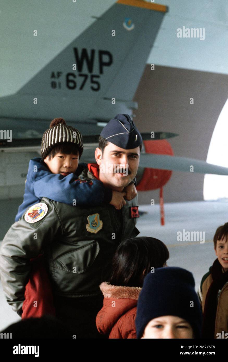 1LT Mike Reed, a pilot with the 36th Tactical Fighter Squadron, gives a ...