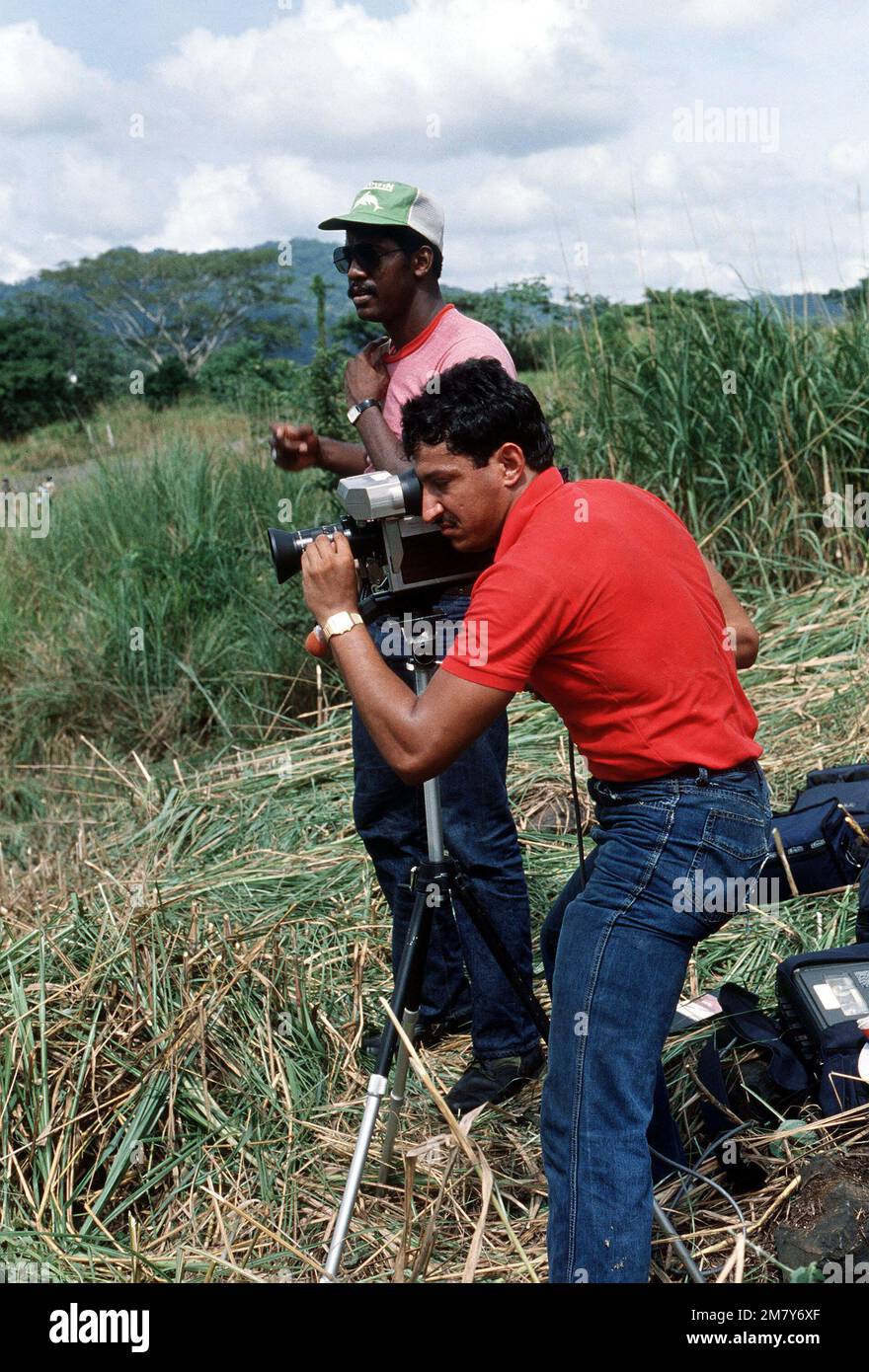 SPECIALIST Fourth Class Ivan Blanco, a television production specialist, videotapes a mass casualty simulation exercise while Claudio Hawkins assists. Base: Howard Air Force Base Country: Panama (PAN) Stock Photo