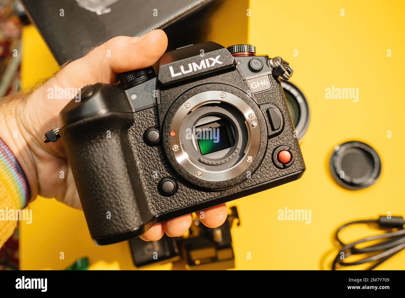 Paris, France Nov 20, 2022 POV male hand holding new Panasonic Lumix