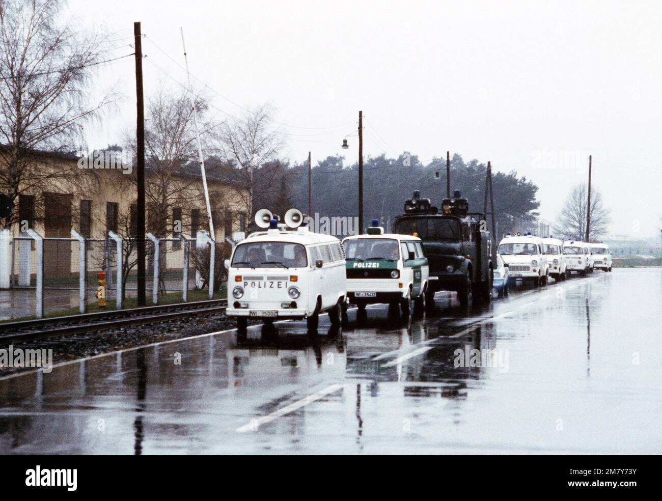 German police vehicles park near the Waldorf gate prior to an expected demonstration against NATO'S decision on Dec. 12, 1979, to deploy Pershing II and cruise missiles in Europe unless the Soviet's agree to scrap their nuclear weapons aimed at Western Europe. Base: Rhein-Main Air Base Country: Deutschland / Germany (DEU) Stock Photo