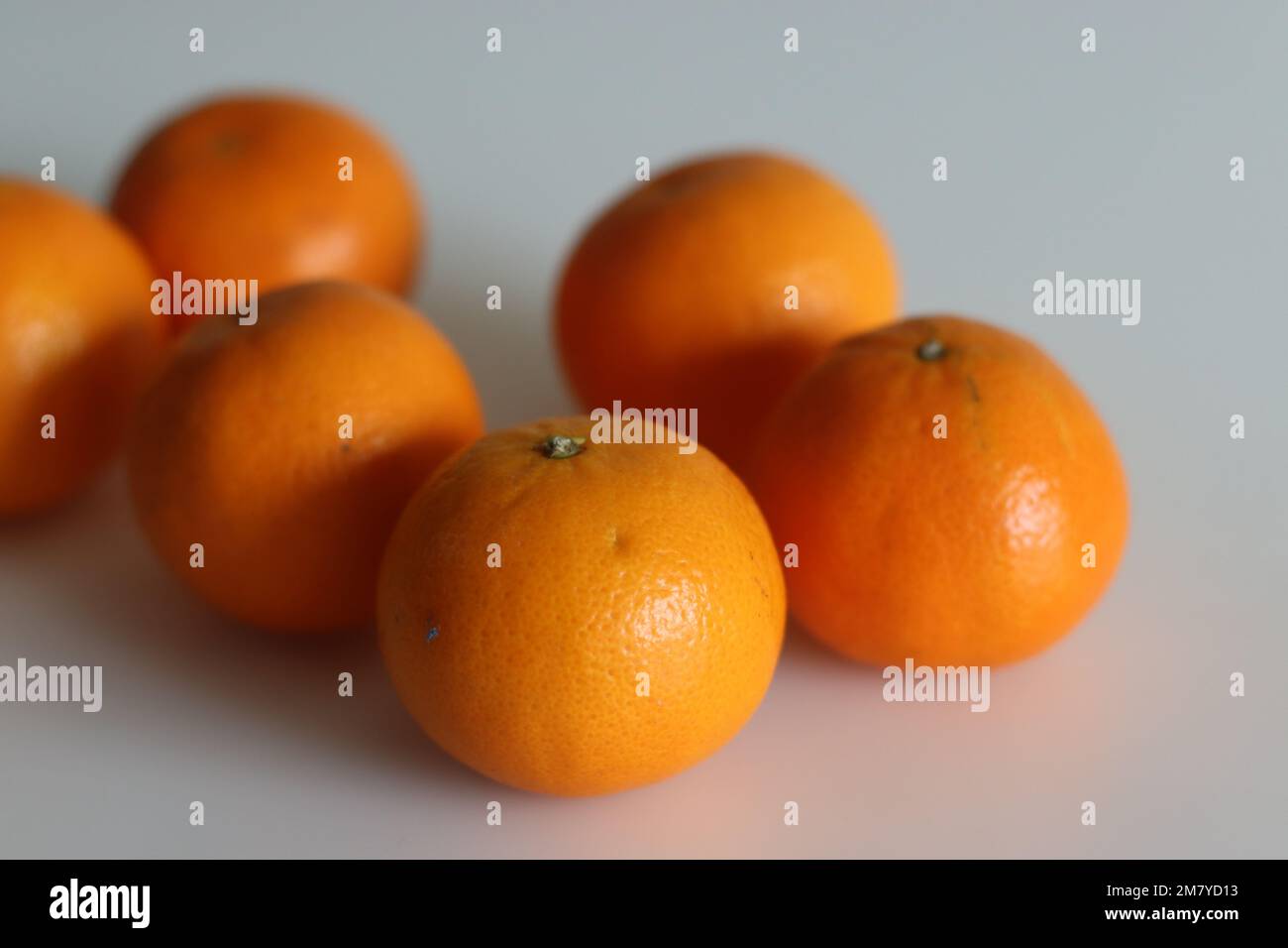 Malta or Valencia Orange is a citrus fruit grown in India, commonly called as sangtra. It is a large orange variety with a smooth and pebbled surface Stock Photo